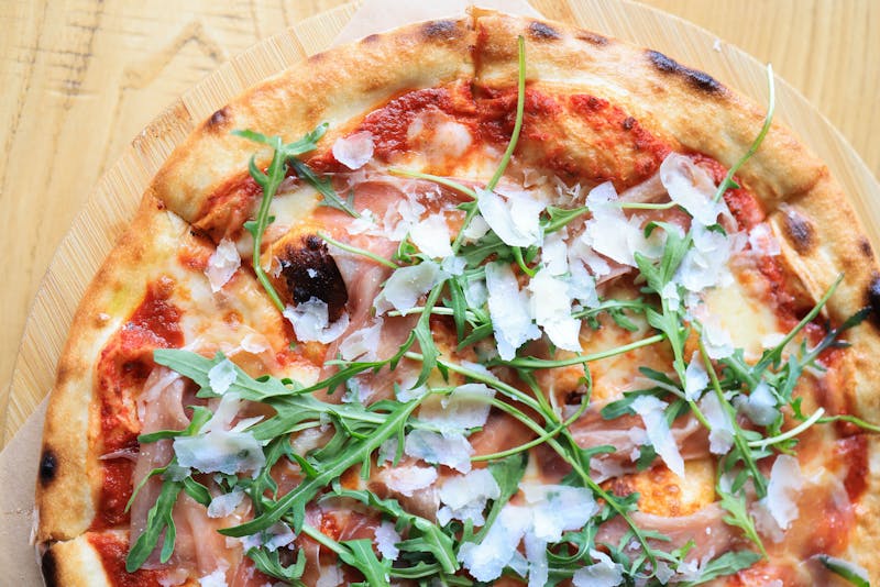 prosciutto arugula pizza with lemon zest
