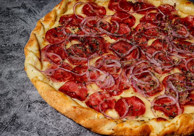 fresh pizza preparation for catering order